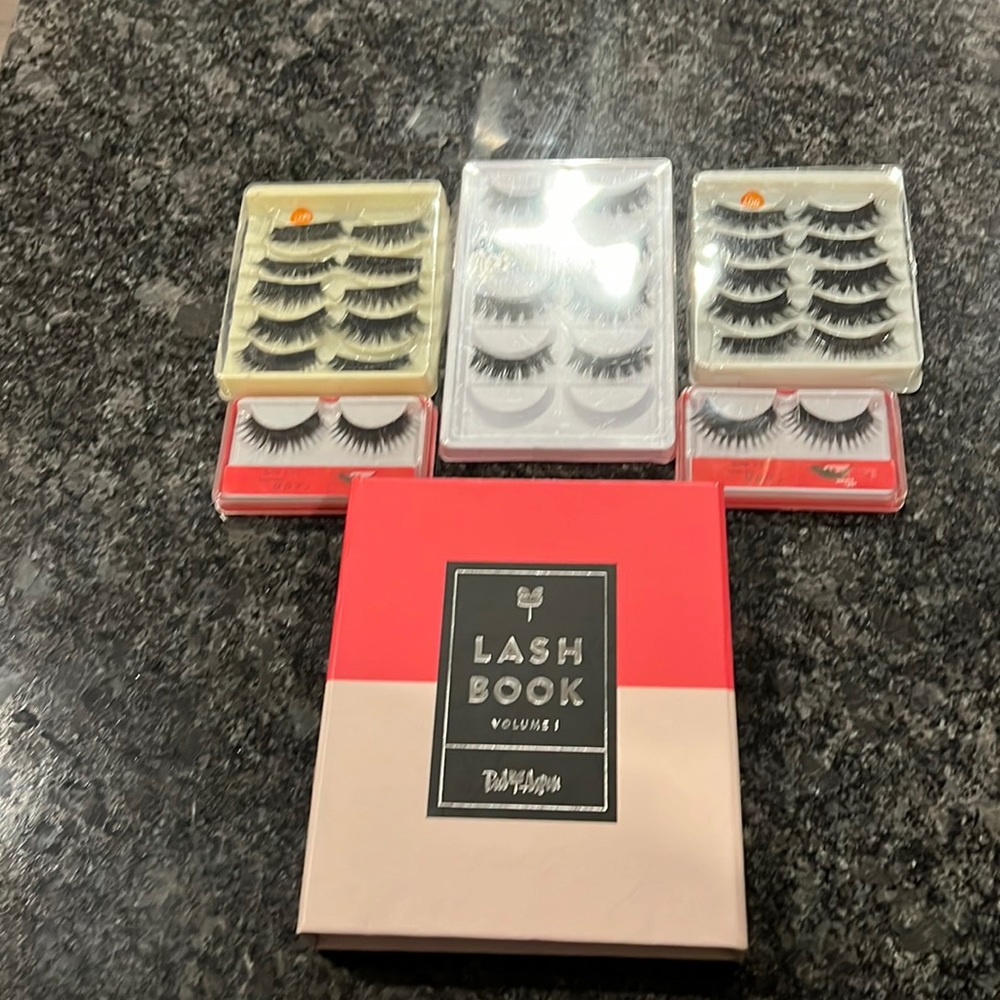 Eyelashes and a lash book with tools to put on the lashes all new